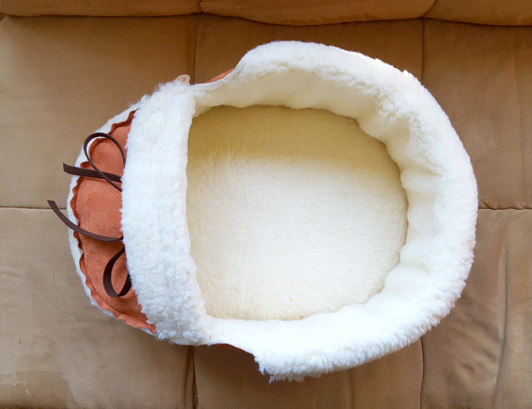 top view of moccasin pet bed in orange
