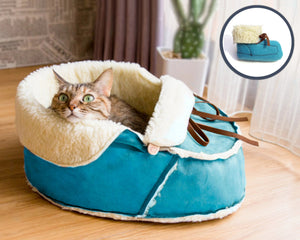 blue moccasin bed with a matching cat toy gift set